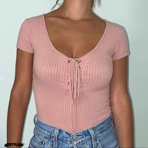 Pink body suit tie up in front